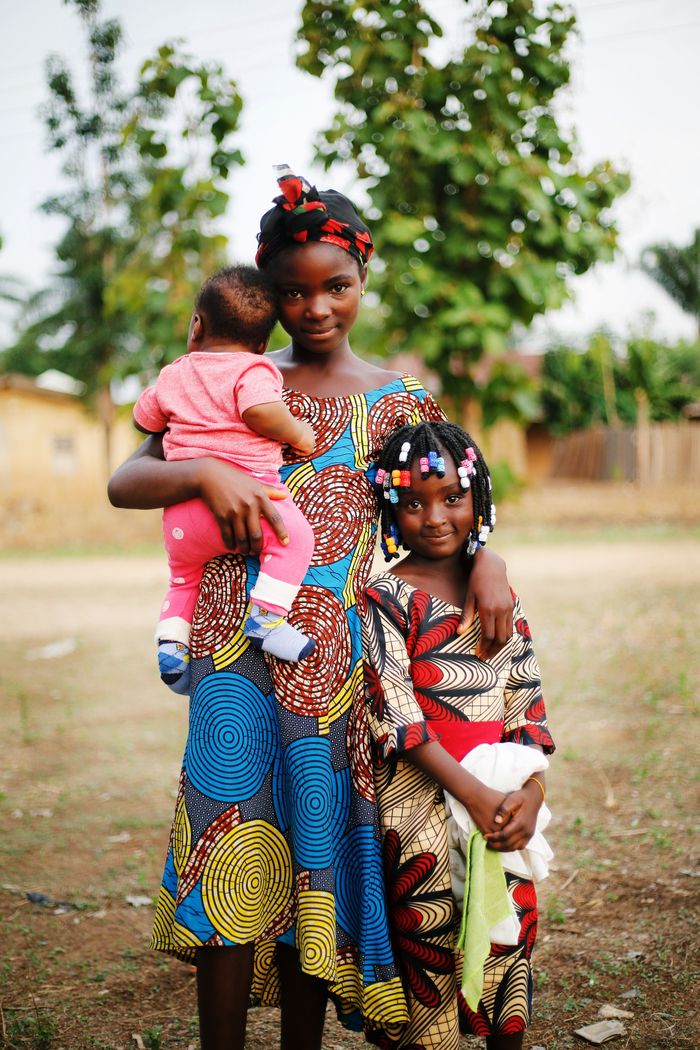 Vibrant family portrait in Abuja, Nigeria, showcasing cultural attire.